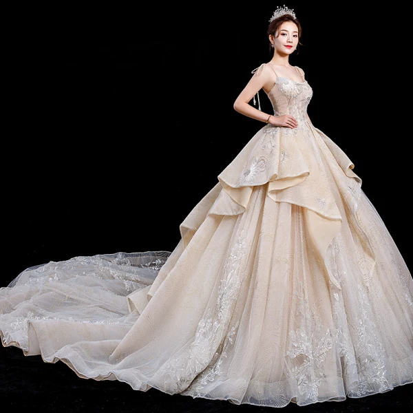 Atemberaubend Champagner Brautkleider / Hochzeitskleider 2020 Ballkleid Spaghettiträger Ärmellos Rückenfreies Glanz Tülle Applikationen Spitze Perlenstickerei Königliche Schleppe Rüschen