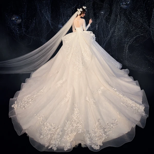 Charming Champagne See-through Wedding Dresses 2020 Ball Gown Scoop Neck Sleeveless Backless Pierced Appliques Lace Beading Glitter Tulle Cathedral Train Ruffle