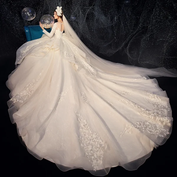 Charming Champagne See-through Wedding Dresses 2020 Ball Gown Scoop Neck Sleeveless Backless Pierced Appliques Lace Beading Glitter Tulle Cathedral Train Ruffle