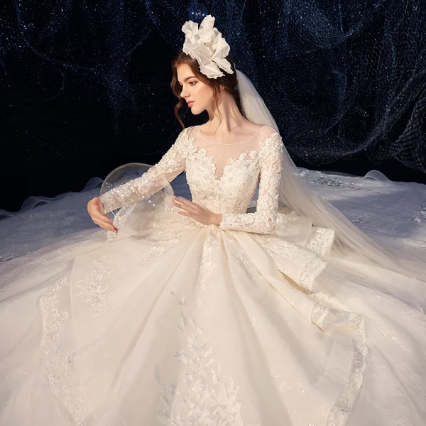 Charming Champagne See-through Wedding Dresses 2020 Ball Gown Scoop Neck Sleeveless Backless Pierced Appliques Lace Beading Glitter Tulle Cathedral Train Ruffle
