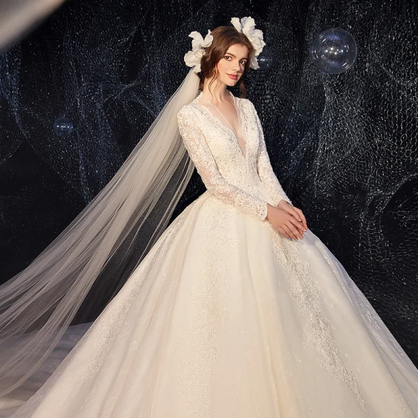 Chic / Beautiful Champagne Wedding Dresses 2020 Ball Gown Deep V-Neck Long Sleeve Backless Glitter Tulle Pierced Appliques Lace Beading Pearl Cathedral Train Ruffle