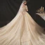 Glamour Champagne Perle La Mariée Robe De Mariée 2020 Princesse Manches Courtes Encolure Carrée Perlage Bretelles croisées Scintillantes Tulle Plage Chapel Train Noeud Ceinture