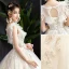 Audrey Hepburn Style Champagne Wedding Dresses 2019 A-Line / Princess Ruffle Scoop Neck Beading Lace Flower Sleeveless Backless Floor-Length / Long