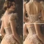 High-end Champagne Wedding Dresses 2019 A-Line / Princess High Neck Beading Sequins Lace Flower Short Sleeve Tassel Backless Cathedral Train