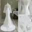 Mode Ivory / Creme Meerjungfrau Brautkleider / Hochzeitskleider 2021 Rundhalsausschnitt Pailletten Schleife Spitze Blumen Lange Ärmel Rückenfreies Sweep / Pinsel Zug Hochzeit