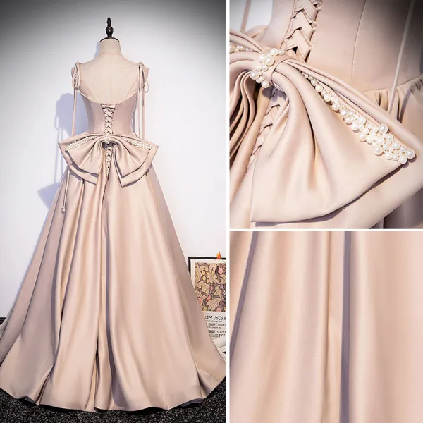 Elegante Champagner Satin Ballkleider 2022 A Linie Spaghettiträger Perlenstickerei Perle Ärmellos Rückenfreies Schleife Lange Festliche Kleider