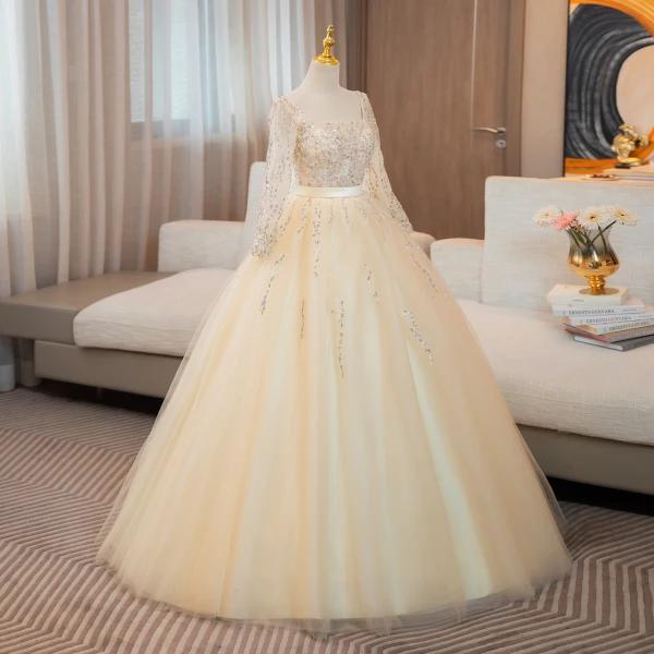 Bling Bling Champagne Perlage Paillettes Robe De Bal 2024 Robe Boule Encolure Carrée Manches Longues Dos Nu Noeud Longue Promo Robe De Ceremonie