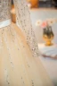 Bling Bling Champagne Perlage Paillettes Robe De Bal 2024 Robe Boule Encolure Carrée Manches Longues Dos Nu Noeud Longue Promo Robe De Ceremonie
