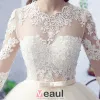 2016 Gorgeous Ball Gown Lace Neckline Pierced Design Backless Champagne Tulle Wedding Dress With Bow Sash