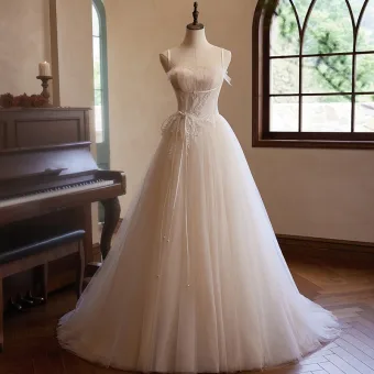 Chic Beautiful Champagne Beading Pearl Lace Flower Prom Dresses 2024 Ball Gown Spaghetti Straps Sleeveless Backless Bow Sash Sweep Train