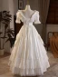 Vintage / Originale Médiévale Ivoire Satin Noeud En Dentelle Robe De Mariée 2024 Princesse V-Cou Manches Courtes Dos Nu Longue Mariage