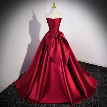 Elegant Burgundy Satin Prom Dresses 2023 Ball Gown Strapless Bow Sleeveless Backless Sweep Train Formal Dresses