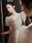 Modern / Fashion Champagne Glitter Graduation Dresses 2022 A-Line / Princess V-Neck Puffy Short Sleeve Backless Sequins Tea-length Formal Dresses
