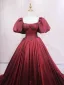 Demure Burgundy Prom Dresses 2025 Ball Gown Off-The-Shoulder Puffy Short Sleeve Backless Sweep Train Prom Formal Dresses