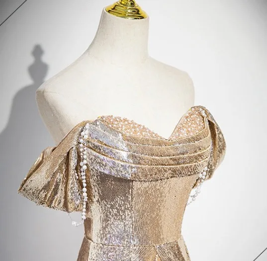 Sexy Scintillantes Doré Paillettes Robe De Soirée 2025 Trompette / Sirène Bustier Sans Manches Dos Nu Train De Balayage Soirée Robe De Ceremonie