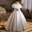 Elegant White Pearl Flower Satin Wedding Flower Girl Dresses 2026 Ball Gown Off-The-Shoulder Short Sleeve Floor-Length / Long