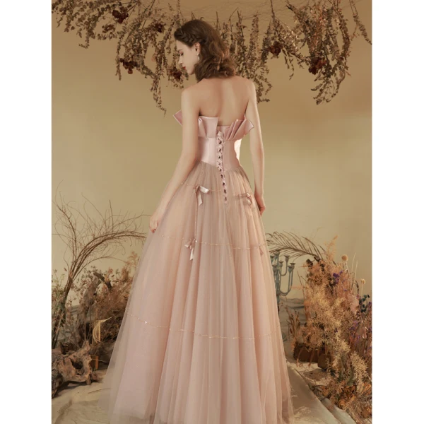 Charmant Rougissant Rose Perlage Robe De Soirée 2023 Princesse Bustier Noeud Sans Manches Dos Nu Longue Soirée Robe De Ceremonie