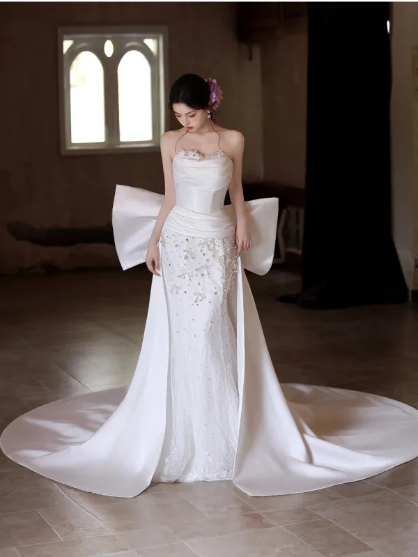 Elegant White Pearl Rhinestone Satin Wedding Dresses 2025 Trumpet / Mermaid Strapless Sleeveless Backless Bow Court Train