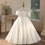Elegante Ivory / Creme Satin Schleife Hochzeit Blumenmädchenkleider 2026 Ballkleid Rundhalsausschnitt Kurze Ärmel Rückenfreies Lange