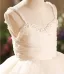 Elegante Weiß Perle Hochzeit Blumenmädchenkleider 2026 Ballkleid Spaghettiträger Ärmellos Rückenfreies Wadenlang