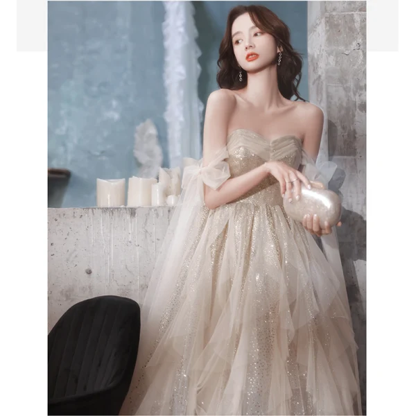 Sexy Charmant Champagne Paillettes Robe De Bal 2022 Princesse Bustier Noeud Sans Manches Dos Nu Longue Promo Robe De Ceremonie