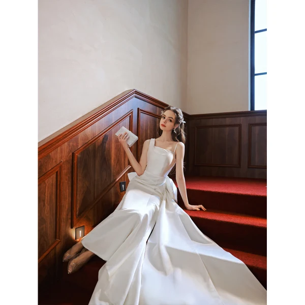Schlicht Mode Ivory / Creme Satin Brautkleider / Hochzeitskleider 2022 Meerjungfrau Spaghettiträger Ärmellos Rückenfreies Schleife Hof-Schleppe Hochzeit