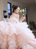Charming Blushing Pink Cascading Ruffles Wedding Dresses 2023 Ball Gown Spaghetti Straps Tassel Sleeveless Backless Bow Sash Chapel Train Wedding