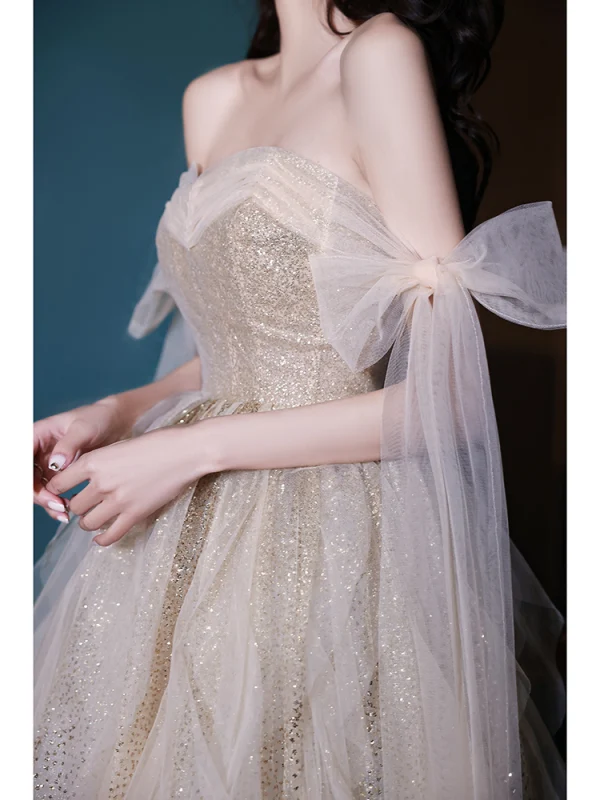 Sexy Charmant Champagne Paillettes Robe De Bal 2022 Princesse Bustier Noeud Sans Manches Dos Nu Longue Promo Robe De Ceremonie