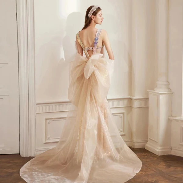 Scintillantes Sexy Champagne Paillettes Robe De Soirée 2022 Trompette / Sirène Encolure Carrée Sans Manches Dos Nu Noeud Tribunal Train Soirée Robe De Ceremonie