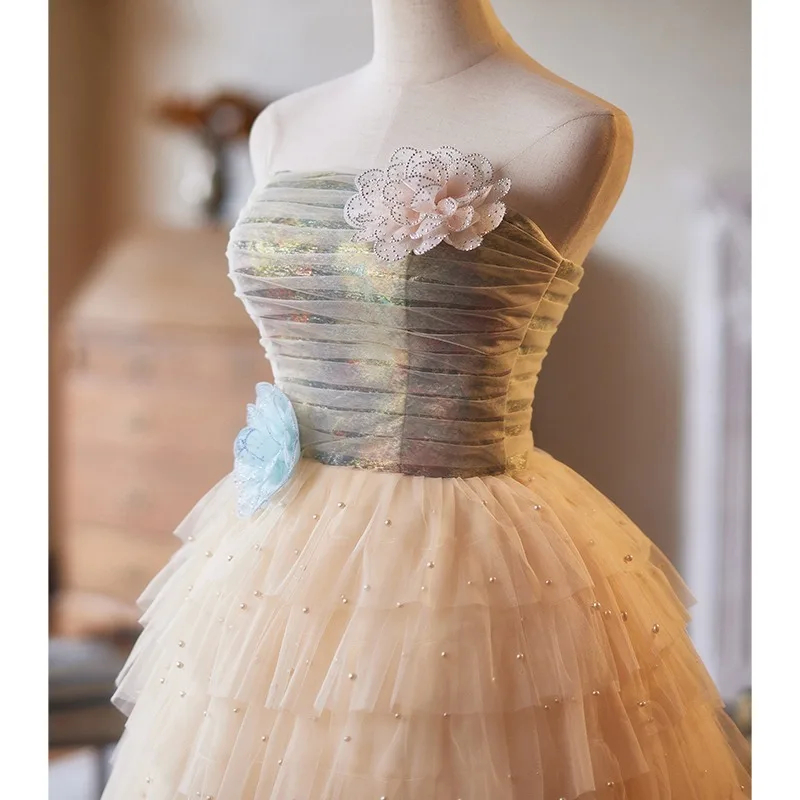 Charming Champagne Pearl Appliques Homecoming Graduation Dresses 2025 A Line Princess Strapless Sleeveless Backless Tea Length Formal Dresses Charming Champagne Pearl Appliques Homecoming Graduation Dresses 2025 A Line Princess Strapless Sleeveless Backless Tea Length Formal Dresses
