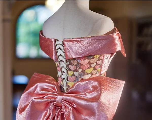 Charmant Rose Bonbon Forme de coeur Paillettes Robe De Bal 2024 Trompette / Sirène De l'épaule Sans Manches Dos Nu Noeud Train De Balayage Satin Promo Robe De Ceremonie