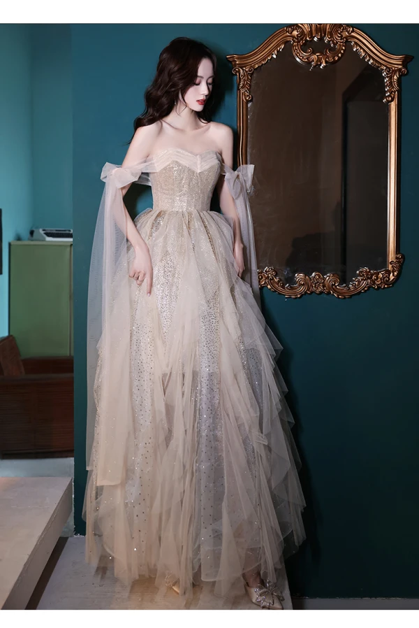 Sexy Charmant Champagne Paillettes Robe De Bal 2022 Princesse Bustier Noeud Sans Manches Dos Nu Longue Promo Robe De Ceremonie