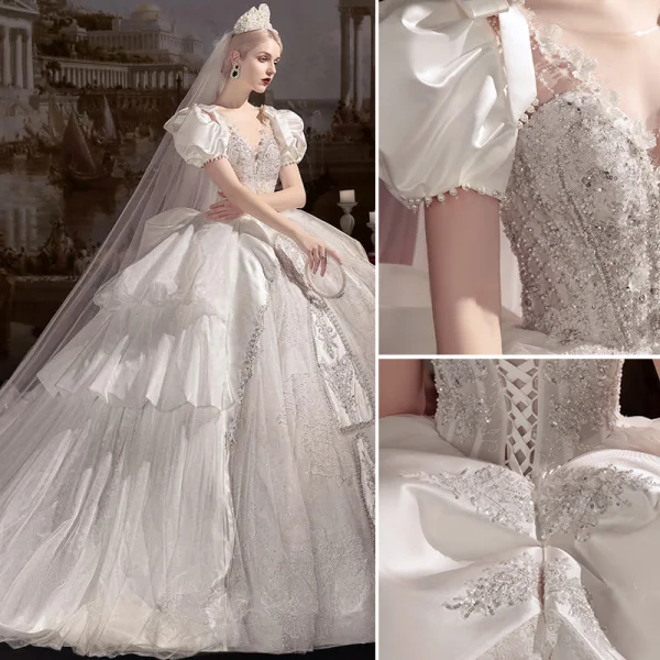Lyx Elfenben Cascading Volanger Bröllopsklänningar 2022 Balklänning Urringning Pösigt Korta ärm Beading Pärla Rhinestone Paljetter Halterneck Rosett Royal Train Bröllop