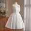 Charmant Blanche Faux Diamant Noeud de retour Robe De Graduation 2025 Robe Boule Bustier Sans Manches Dos Nu Longue Robe De Ceremonie