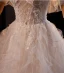 Charmant Weiß Perlenstickerei Perle Spitze Blumen Fallende Rüsche Leichtes Brautkleider / Hochzeitskleider 2024 Ballkleid Spaghettiträger Ärmellos Rückenfreies Sweep / Pinsel Zug