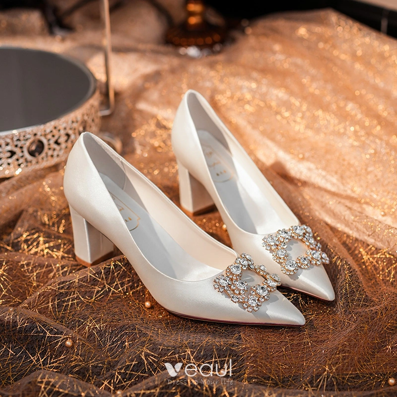 White pearl bridal shoes with plaited leather front toe and pearl block heel