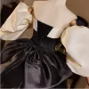 Audrey Hepburn Style Black Prom Dresses 2024 Ball Gown Off-The-Shoulder Puffy Short Sleeve Backless Bow Floor-Length / Long Prom Formal Dresses