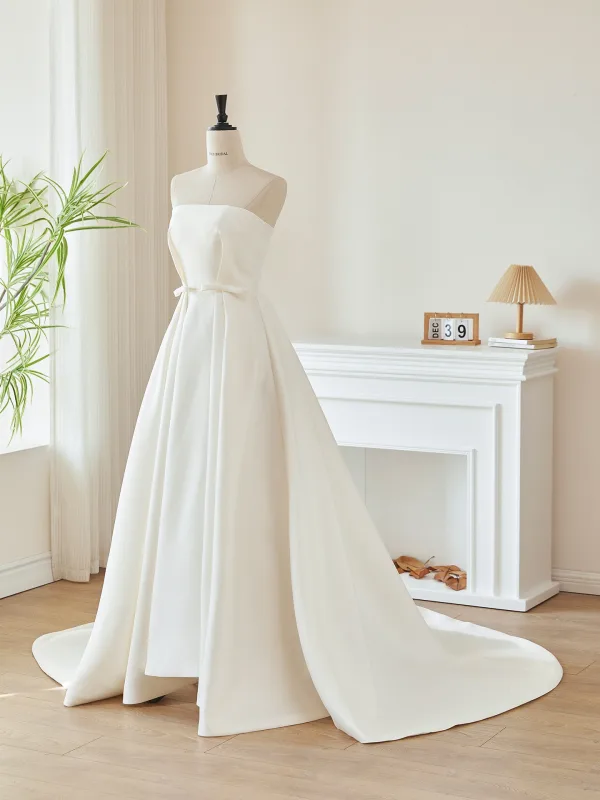 Elegant Elfenben Satin Sløyfe Brudekjoler 2026 Prinsesse Strapless Uten Ermer Ryggløse Feie Tog