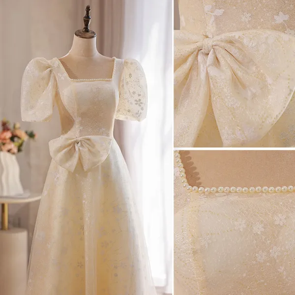 Élégant Champagne En Dentelle Fleur Robe De Bal 2022 Princesse Perle Encolure Carrée Gonflée Manches Courtes Dos Nu Noeud Longue Robe De Ceremonie