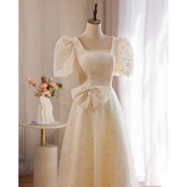 Élégant Champagne En Dentelle Fleur Robe De Bal 2022 Princesse Perle Encolure Carrée Gonflée Manches Courtes Dos Nu Noeud Longue Robe De Ceremonie
