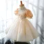 Mode Champagne Perlage Perle Paillettes En Dentelle Fleur Anniversaire Robe Ceremonie Fille 2022 Robe Boule U-Cou Gonflée Manches Courtes Ceinture Noeud Courte Dos Nu Robe Ceremonie Fille