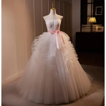 Chic Beautiful White Ball Gown Wedding Dresses 2024 Cascading Ruffles Strapless Sleeveless Backless Bow Sash Sweep Train Wedding Ball Gown