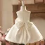 Élégant Champagne Noeud Perle Courte Anniversaire Robe Ceremonie Fille 2024 Robe Boule Encolure Dégagée Sans Manches Tulle