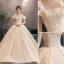 Luxe Champagne Robe De Mariée 2019 Robe Boule Encolure Dégagée Noeud En Dentelle Fleur Manches Courtes Dos Nu Royal Train