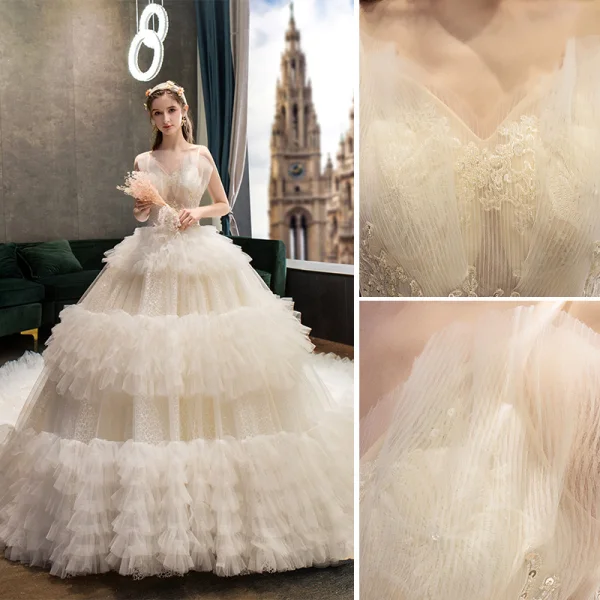 Fabulous Champagne Wedding Dresses 2019 Ball Gown Spaghetti Straps Ruffle Lace Flower Sequins Sleeveless Backless Royal Train