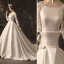 Élégant Ivoire Robe De Mariée 2019 Princesse Encolure Dégagée Noeud En Dentelle Fleur Manches Longues Dos Nu Cathedral Train