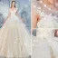 Étourdissant Champagne Robe De Mariée 2019 Princesse Encolure Dégagée Faux Diamant En Dentelle Fleur Appliques Sans Manches Dos Nu Volants en Cascade Royal Train