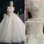 Illusion Champagne Wedding Dresses 2021 Ball Gown Off-The-Shoulder Beading Pearl Rhinestone Sequins Short Sleeve Backless Royal Train Wedding