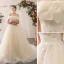 Élégant Champagne Robe De Mariée 2020 Princesse De l'épaule Noeud En Dentelle Fleur Appliques Manches Courtes Dos Nu Cathedral Train
