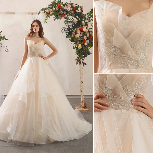 Charmant Champagne Robe De Mariée 2020 Princesse Bretelles Spaghetti Perlage Paillettes En Dentelle Fleur Sans Manches Dos Nu Noeud Volants en Cascade Tribunal Train